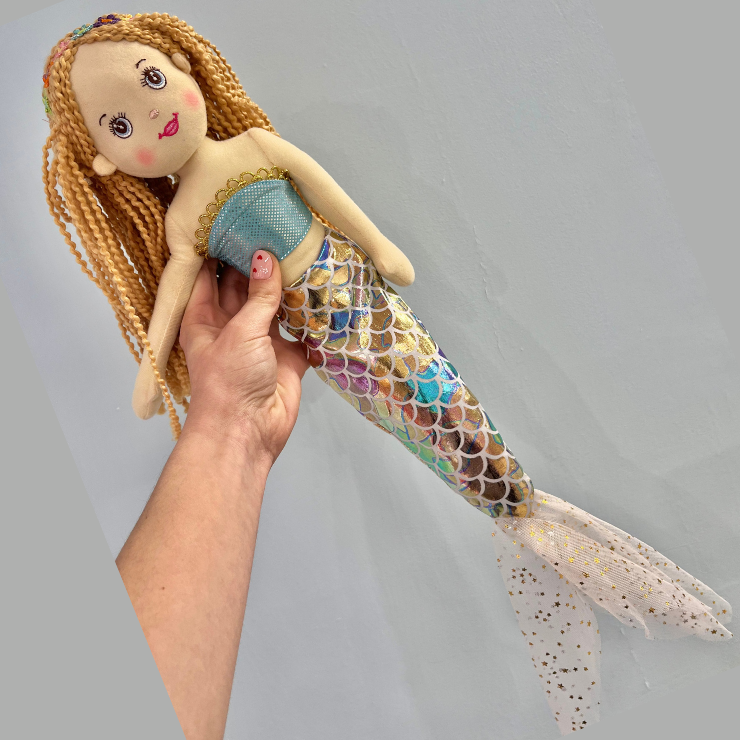 Pink mermaid with rainbow tail